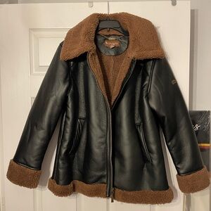 Ugg women's jacket never used brand new black leather and brown fur inside